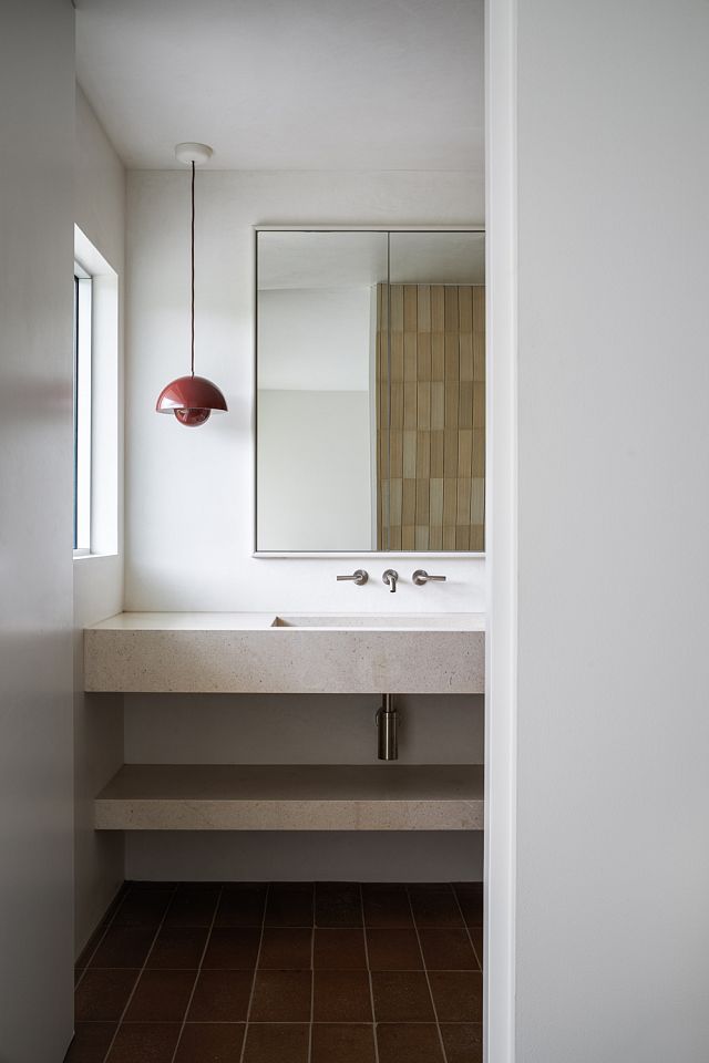 Cotto Manetti Arrotato Da Crudo in Tobacco floors with INAX Belnews Foggy walls and San Sebastian vanity.jpg