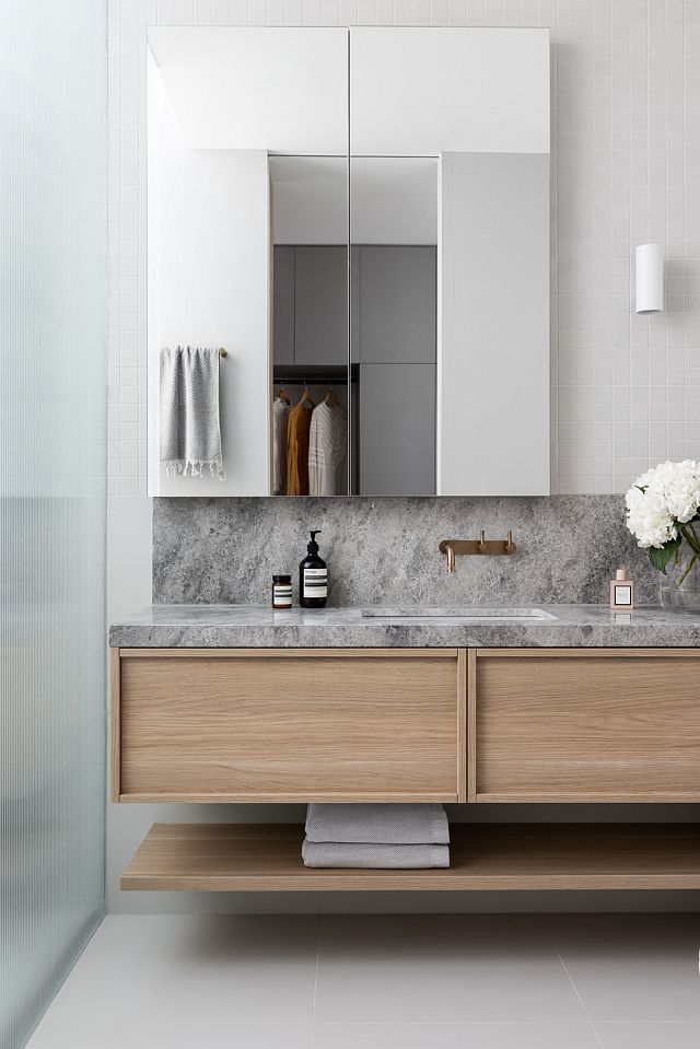 Perla Argento stone bathroom vanity with INAX Sugie Series mosaics and Fiandre Nuances White tile floor at Canning Street cottage by Heartly Design Studio. Photography Dylan James.jpg