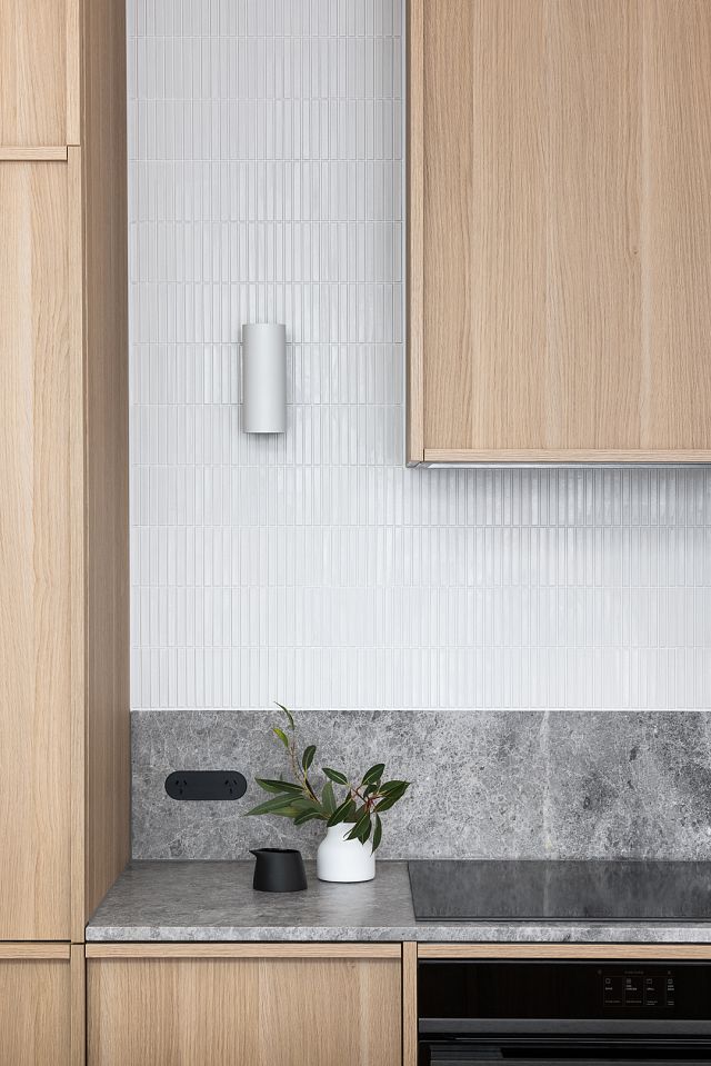 Perla Argento stone benchtop and splashback with INAX Yuki Border mosaics at Canning Street cottage by Heartly Design Studio. Photography Dylan James.jpg