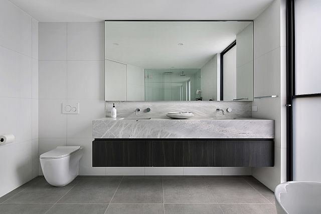 Fjord Grey Natural to floor and Elba Honed marble to vanity. Ashburton Residence by De Arch Architects