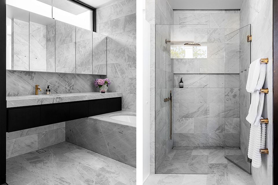 Elba featured on vanity, floors, walls, bath surround and in shower